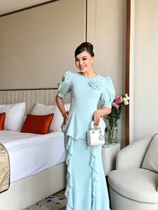 Elegant light blue mermaid dress with puff sleeves and delicate beaded floral details.
