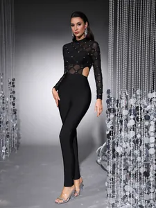 Elegant black long sleeve mesh jumpsuit with pearl beads and side cut-outs