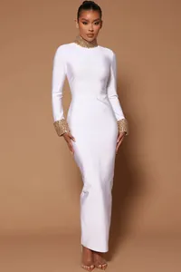 Elegant white long sleeve bandage maxi dress featuring gold beaded neck and cuff details
