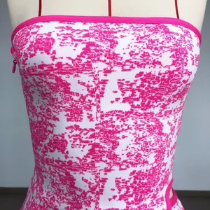 Close-up of rose red and white jacquard bandage fabric on a sexy tube top dress