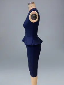 Side view detail of navy blue peplum top and pencil skirt bandage dress set