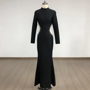 Full view of elegant black long-sleeved evening dress with side mesh rhinestone detailing