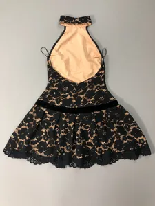 Detailed back view of a black floral lace halter mini dress featuring an elegant eyelash lace hem