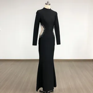 Detail view of black bodycon evening dress with rhinestone mesh side cut-out designs