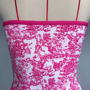 Detailed view of the hot pink and white jacquard texture on this bandage tube top dress