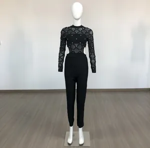 Full view of black mesh long sleeve bandage jumpsuit with hand-set beads on mannequin