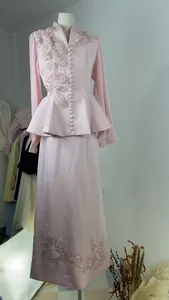 Detailed view of pink elegant two-piece suit with 3D floral embroidery and pleated sleeves.
