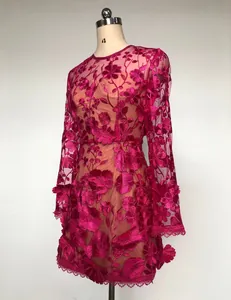 Detailed view of fuchsia long-sleeved dress with 3D floral lace embroidery