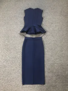 Detailed back view of navy blue bandage two-piece set with peplum top and pencil skirt