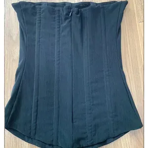 Detailed view of a black high-stretch mesh corset tube top with vertical boning