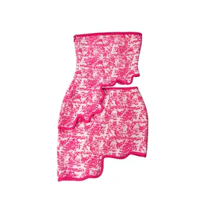 Detailed view of women's pink jacquard tube top and irregular wavy hem mini skirt set
