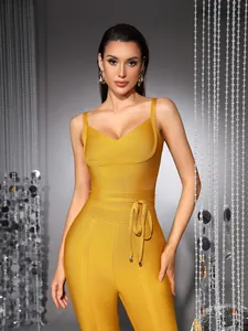 Detailed macro view of high-quality yellow V-neck bandage jumpsuit with slim-fit waist tie