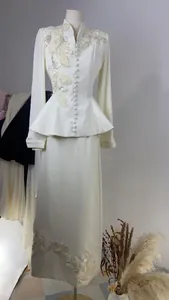 Elegant off-white two-piece formal suit with floral embroidery and pleated sleeves detail