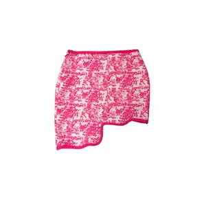 Detailed view of women's irregular magenta jacquard mini skirt with unique scalloped hemline
