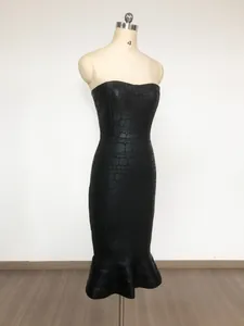 Detailed view of a black crocodile pattern strapless mermaid midi dress on mannequin
