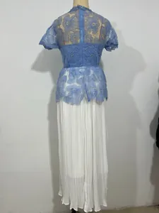 Back detail view of light blue lace floral top and white pleated maxi skirt dress