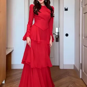 Elegant red maxi dress featuring long sleeves tiered ruffles and a floral appliqué detail