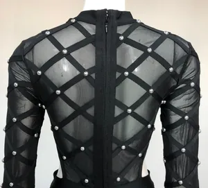 Detailed back view of a black mesh bandage bodysuit with silver studs and hidden zipper