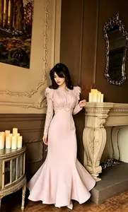 Full length view of elegant pink lace mermaid gown showing the detailed lace sleeves and hem