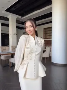 Elegant cream textured floral peplum suit set with embroidery for women autumn fashion.