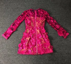 Detailed back view of magenta lace mini dress with 3D floral embroidery details