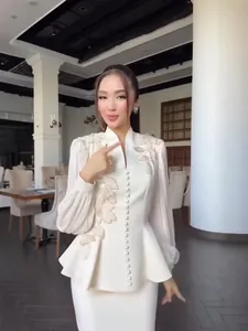 Elegant white floral embroidered peplum suit set for women, formal autumn fashion outfit.
