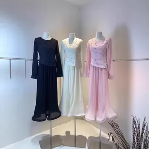 Elegant pleated long-sleeve dresses with rhinestone wave patterns in black, cream, and pink.