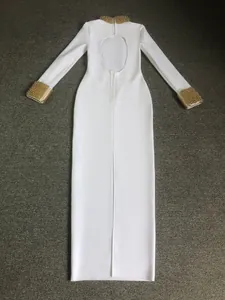 Elegant white bandage long dress with gold beaded collar and cuffs, featuring a backless design.