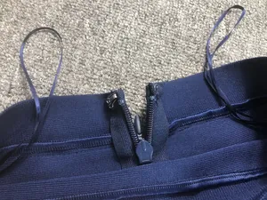 Detailed view of navy blue bandage dress with hidden zipper and hook closure