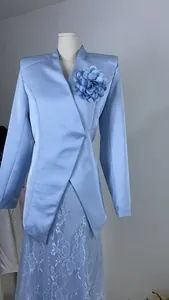 Elegant light blue satin blazer suit set featuring a large flower brooch and lace skirt