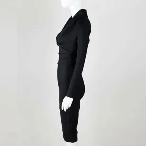 Side view of a sophisticated black long-sleeved deep V-neck bandage evening dress