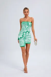 Elegant green and white jacquard strapless cocktail dress with unique asymmetrical hemline.