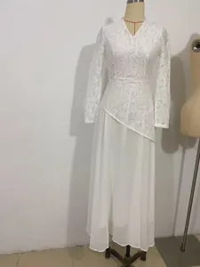 Detail showing the elegant white lace bodice and flowing chiffon skirt of this maxi dress.