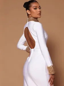 Elegant white bandage maxi dress featuring intricate gold beading and a sexy open back design