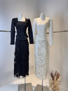 Elegant long sleeve maxi dress featuring heavy lace floral embroidery in black and white