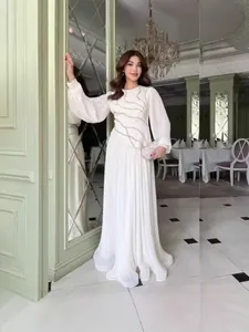 Elegant white pleated maxi dress with luxury rhinestone detailing and long sleeves