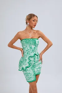 Close-up detail of the green and white jacquard texture and irregular wavy hemline.