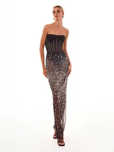 Detailed view of elegant two-piece sequined mesh evening gown with strapless corset top