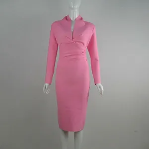 Detail view of pink long-sleeved bandage dress with deep V-neck and gathered waist
