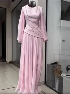 Elegant pink long-sleeved pleated maxi dress with diamond embellishments