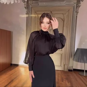 Elegant black French evening gown with sheer lantern sleeves and beaded neck detail
