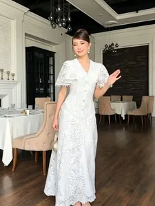 Elegant white lace maxi dress with tassel sleeves and V-neck for 2026 spring fashion