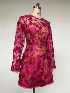 Elegant magenta long sleeve dress with 3D floral lace embroidery on mannequin