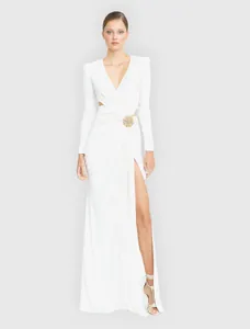 Elegant white long-sleeved maxi dress with V-neck, cut-out waist, and high side slit detail