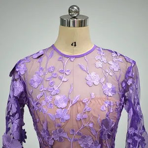 Detail shot of purple lace evening dress featuring exquisite floral embroidery patterns