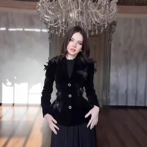 Detail of black velvet jacket with 3D butterflies and elegant buttons for women