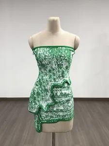 Close-up view of a green jacquard tube top dress featuring a unique irregular wavy hem design