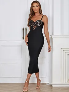 Elegant black bandage midi dress featuring a delicate floral lace bustier on a female model