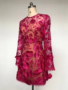 Elegant fuchsia lace mini dress featuring 3D floral embroidery, long sleeves, and a slim fit design
