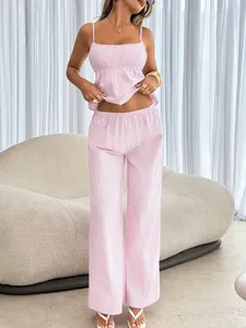 Detail shot of pink striped two-piece set with crop tank top and wide leg pants.